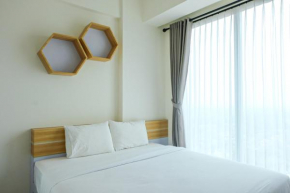 Compact 1BR at Tree Park Apartment By Travelio